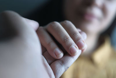 Man hand holding women hand