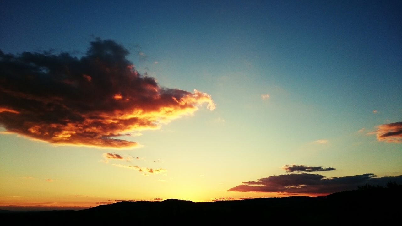 sunset, silhouette, tranquil scene, scenics, tranquility, beauty in nature, sky, orange color, nature, idyllic, landscape, blue, cloud - sky, cloud, outdoors, majestic, no people, non-urban scene, dusk, sunlight