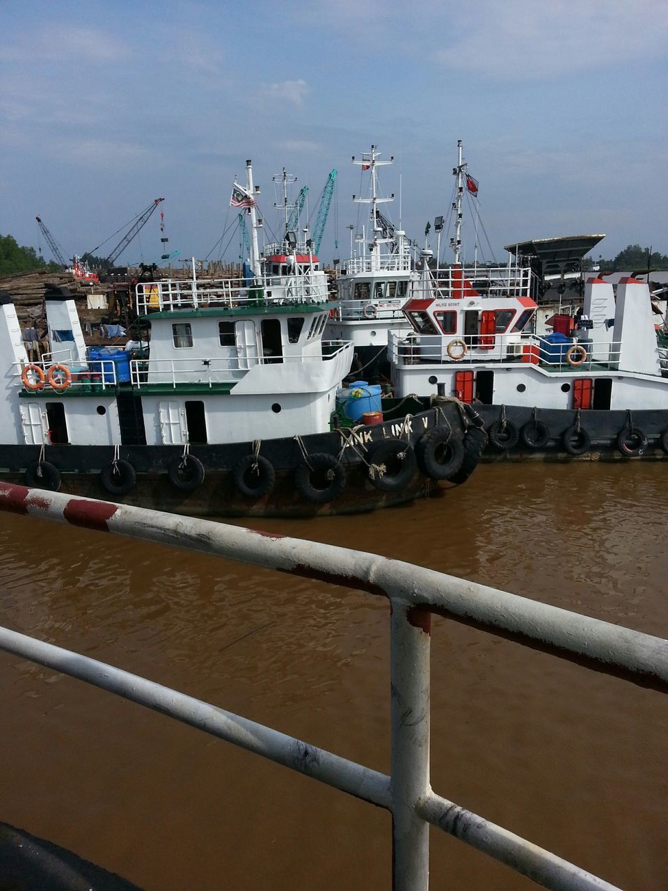 transportation, mode of transport, nautical vessel, harbor, moored, boat, sky, freight transportation, industry, construction site, crane - construction machinery, public transportation, travel, ship, commercial dock, day, airplane, outdoors, in a row, development