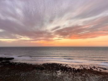Scenic view of sea against sky during sunset