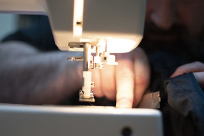 Man working on sewing machine