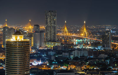 Illuminated buildings in city at night