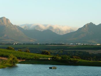 Scenic view of river and mountains