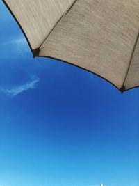 Low angle view of roof against blue sky