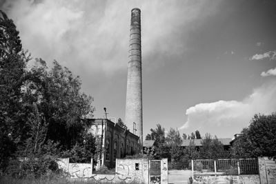 Low angle view of factory against sky