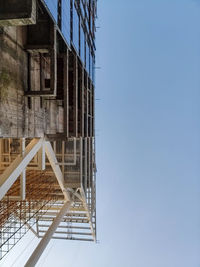 Low angle view of building against clear blue sky