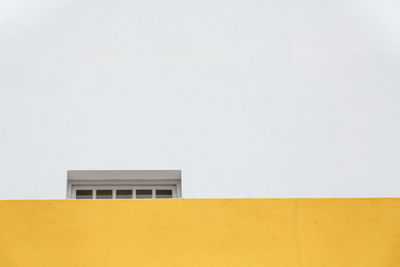 Close-up of yellow wall of building