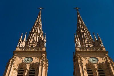 Low angle view of temple building against clear blue sky