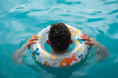 High angle view of woman swimming in pool