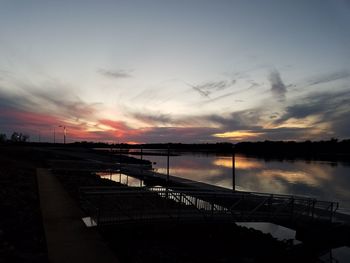 Scenic view of silhouette bridge against sky during sunset