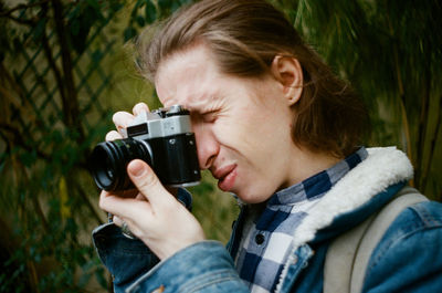 Man photographing with camera