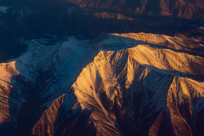 Colorado mountain peaks from 28,000 feet at dawn.