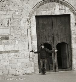 Woman standing in front of wall