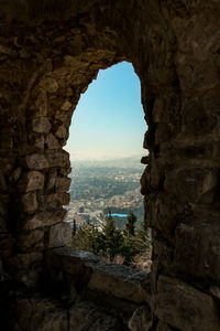 View of sea seen through arch window