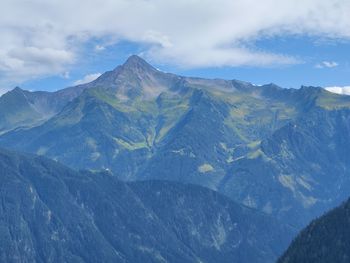 Scenic view of snowcapped mountains against sky