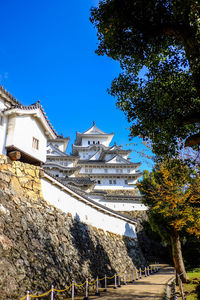 Low angle view of buildings against blue sky