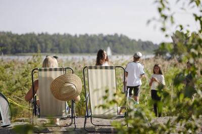 Family relaxing at lake