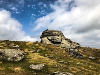 Low angle view of rock formation against sky