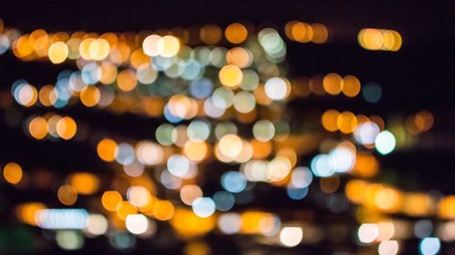 Defocused image of illuminated lighting equipment at night