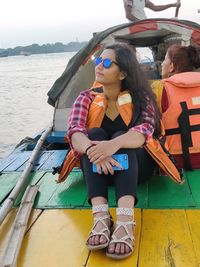 High angle view of woman sitting in boat