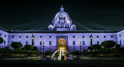 Illuminated cathedral against sky at night