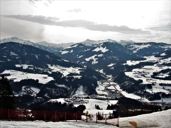 Scenic view of snowcapped mountains against sky