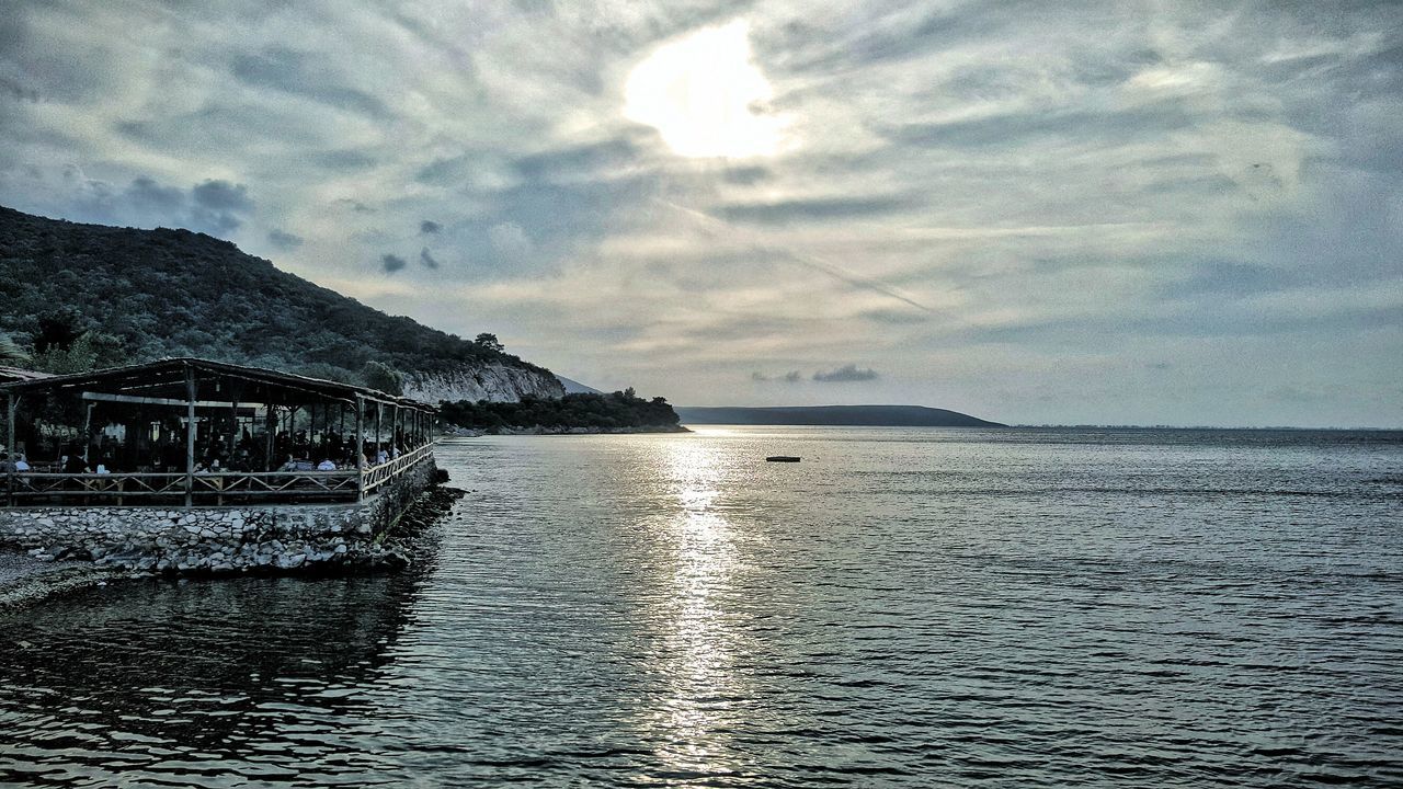 sky, water, sea, cloud - sky, scenics, nature, waterfront, no people, beauty in nature, sunlight, tranquility, outdoors, day, architecture, mountain