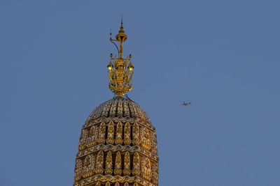 Low angle view of illuminated building against sky