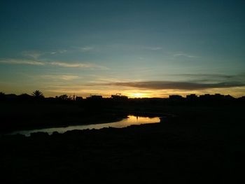 Scenic view of silhouette landscape against sky during sunset