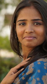 Close-up portrait of a smiling young woman