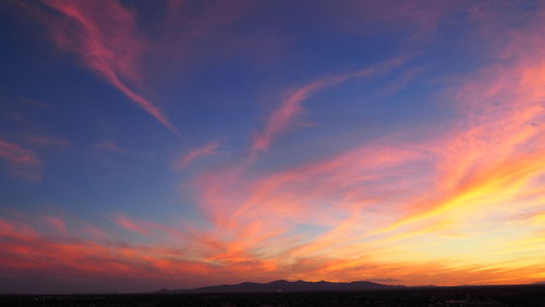 Low angle view of dramatic sky during sunset