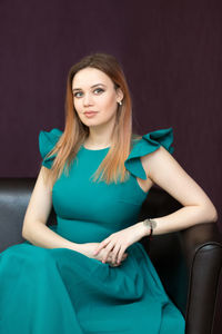 Portrait of a beautiful young woman sitting