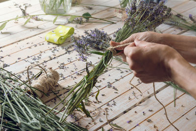 High angle view of person hand on table