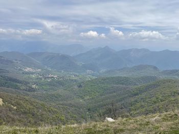 Scenic view of landscape and mountains against sky