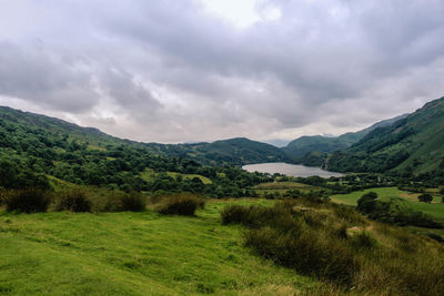 Scenic view of landscape and mountains against sky