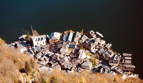 High angle view of buildings on field against sky