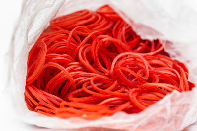 Close-up of red chili peppers in container