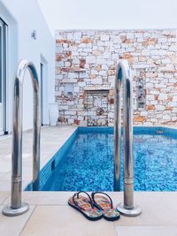 Metallic structure in swimming pool against wall