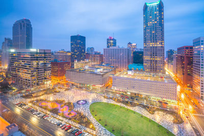 High angle view of illuminated buildings in city against sky