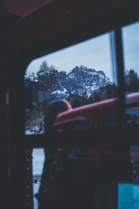 Person looking through window