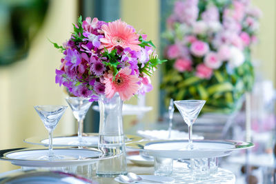 Flowers in glass vase on table