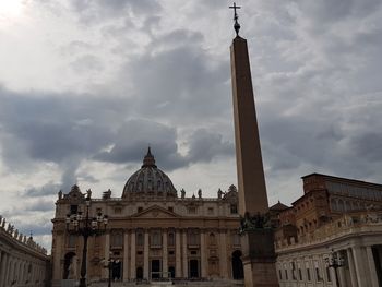 Low angle view of church against cloudy sky