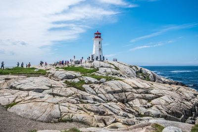 Lighthouse on cliff at seaside