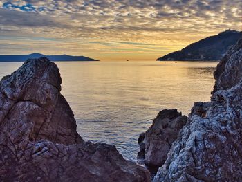 Scenic view of sea against sky during sunset