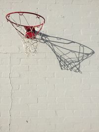 Low angle view of basketball hoop against wall