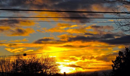 Low angle view of cloudy sky at sunset