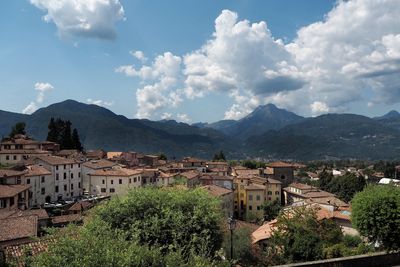 Houses in town against sky