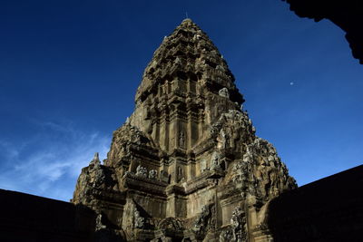 Low angle view of historical building against blue sky