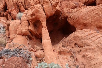 Intricate red rock formations with pillar and cave