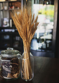 Close-up of glass jar on table at home